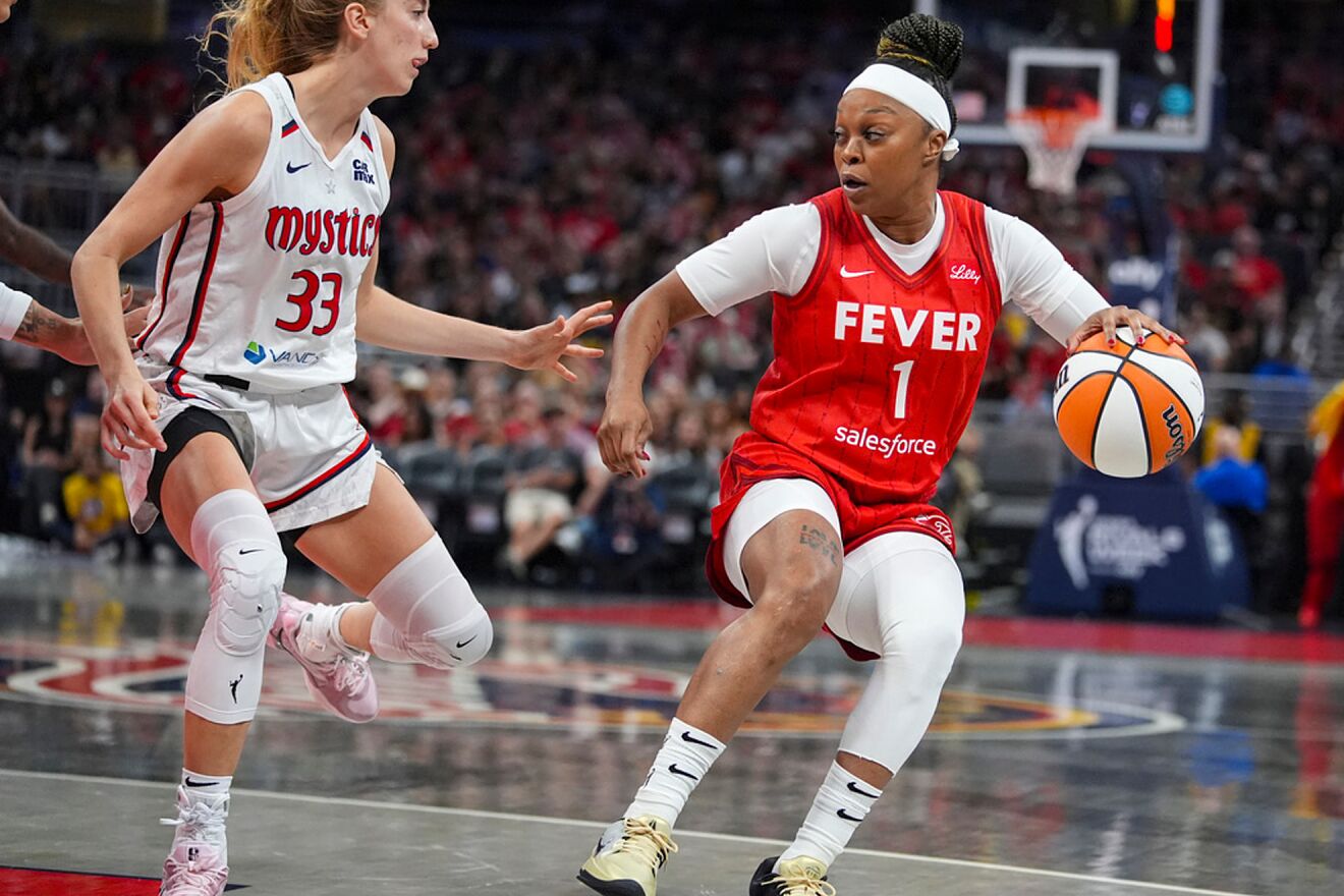 Indiana Fever guard Odyssey Sims drives on Washington Mystics guard...