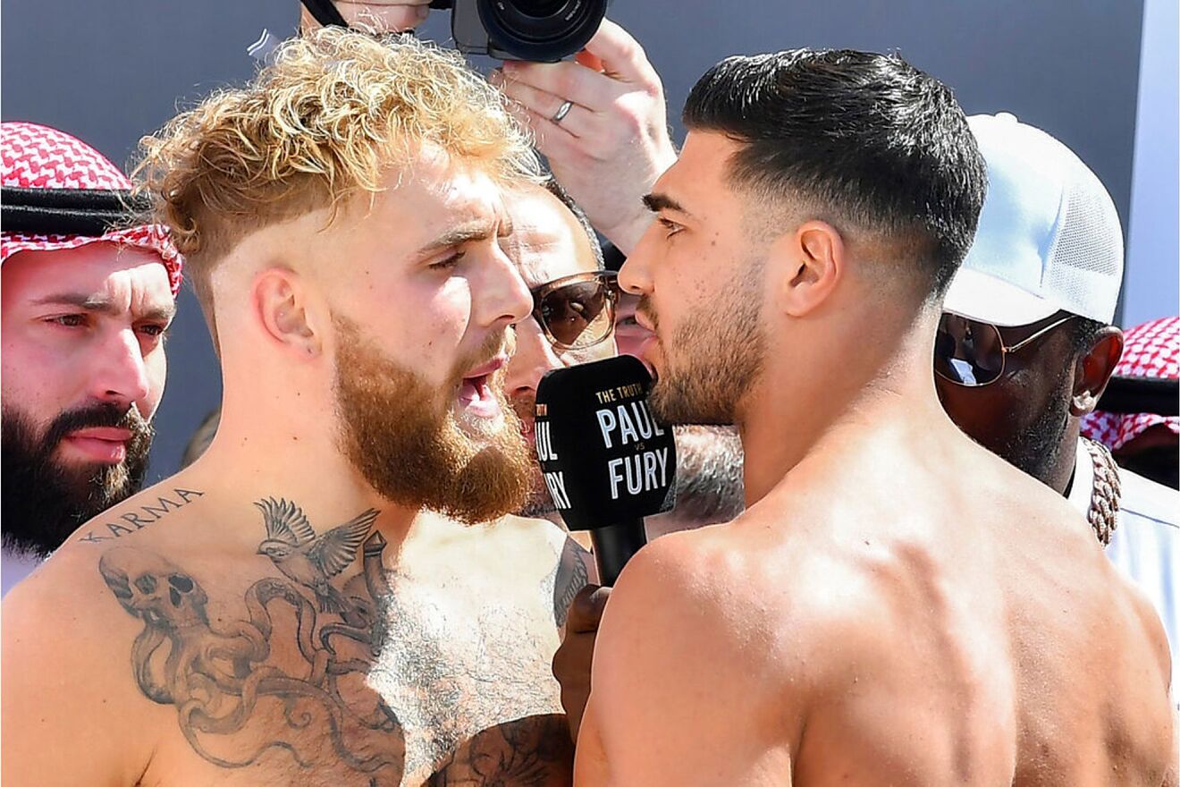 Jake Paul and Tommy Fury, face off after a weigh-in, a day before...