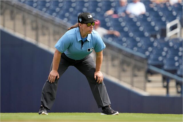 Umpire Jen Pawol takes up her position.
