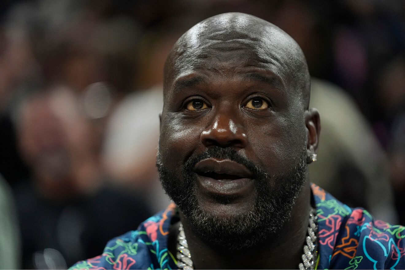 Shaquille O'Neal watches warmups