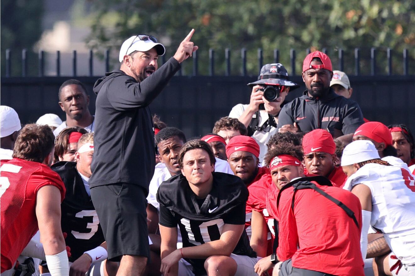 Ohio State coach Ryan Day talks to his team during NCAA college...