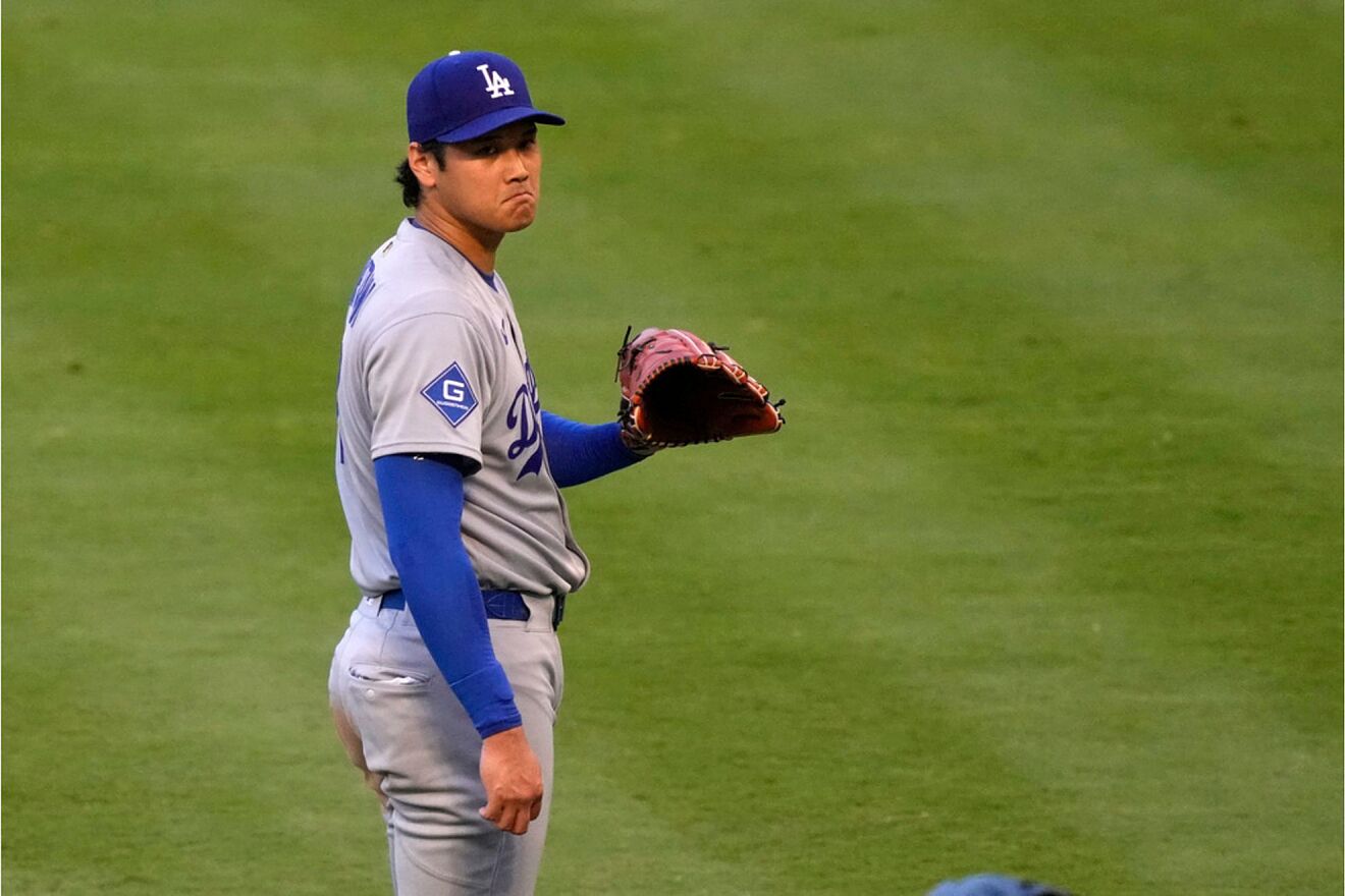 Los Angeles Dodgers starting pitcher Shohei Ohtani waits for a new...