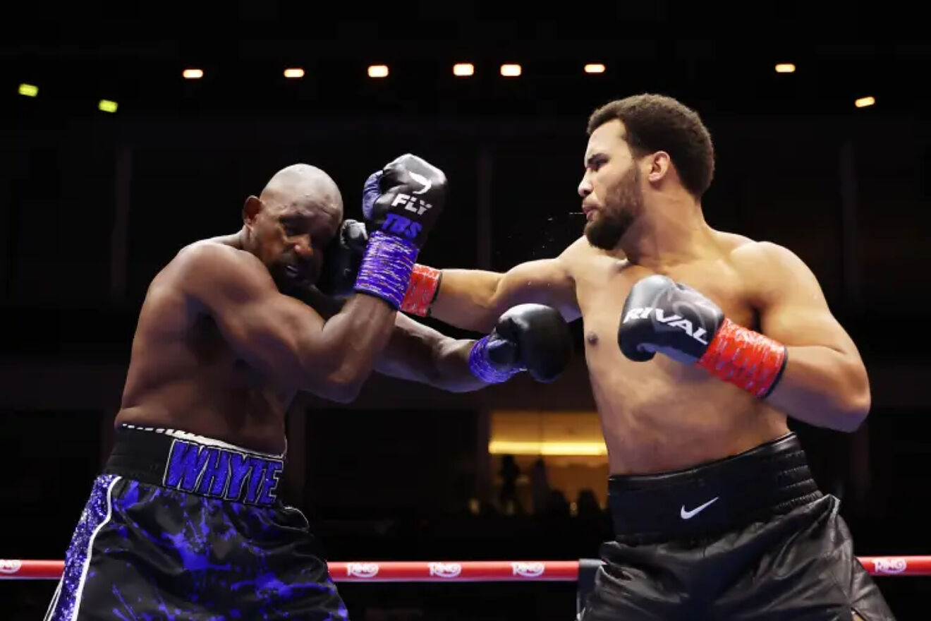 Moses Itauma hits Dillian Whyte with his right fist.