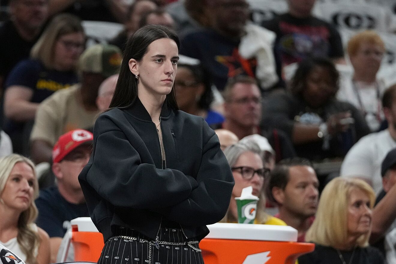 Indiana Fever guard Caitlin Clark watches during the first half of a...